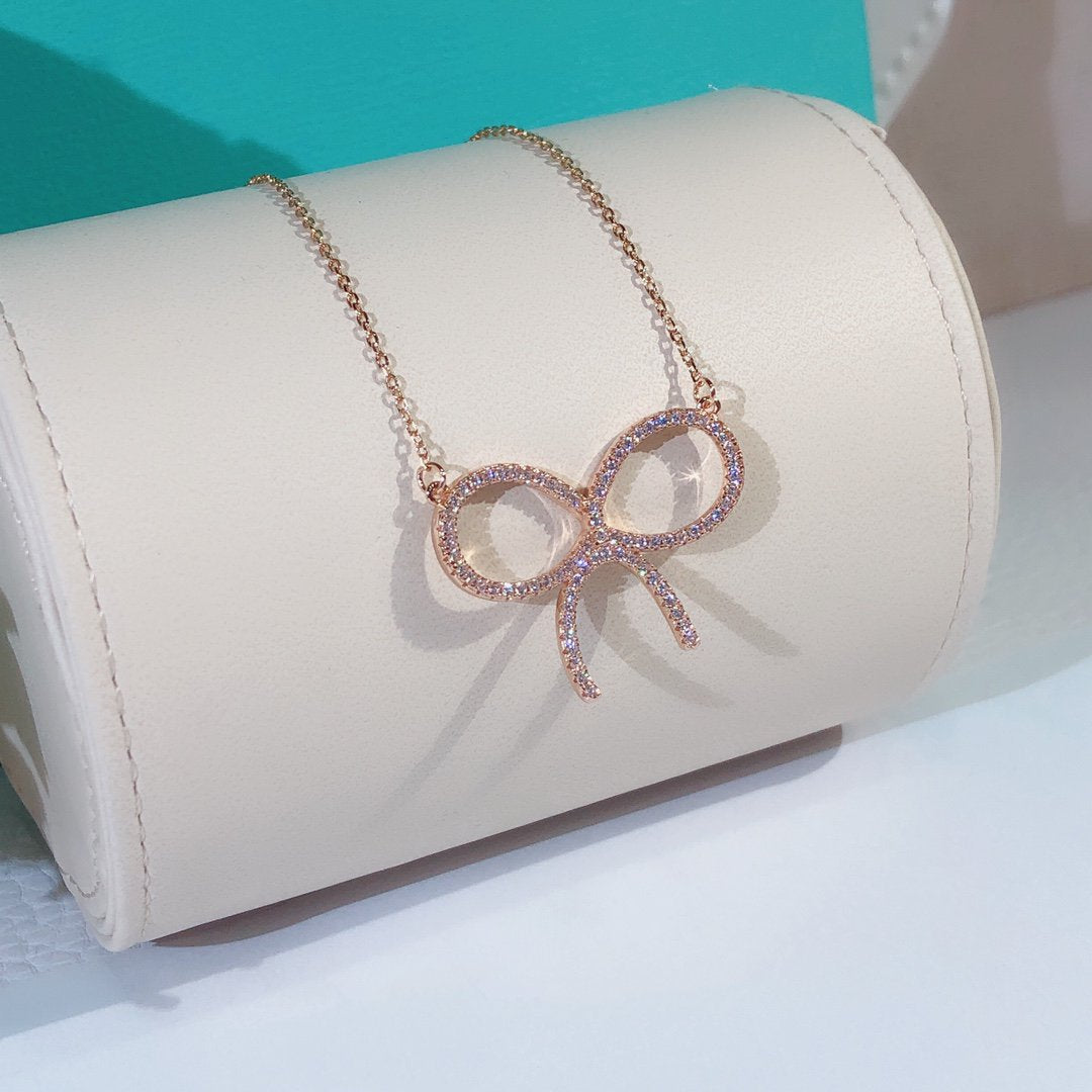 [Resenara Jewelry]CLAW SET RHODIUM PLATED BOW NECKLACE
