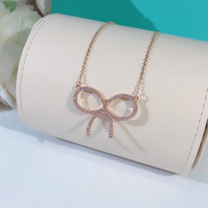 [Resenara Jewelry]CLAW SET RHODIUM PLATED BOW NECKLACE