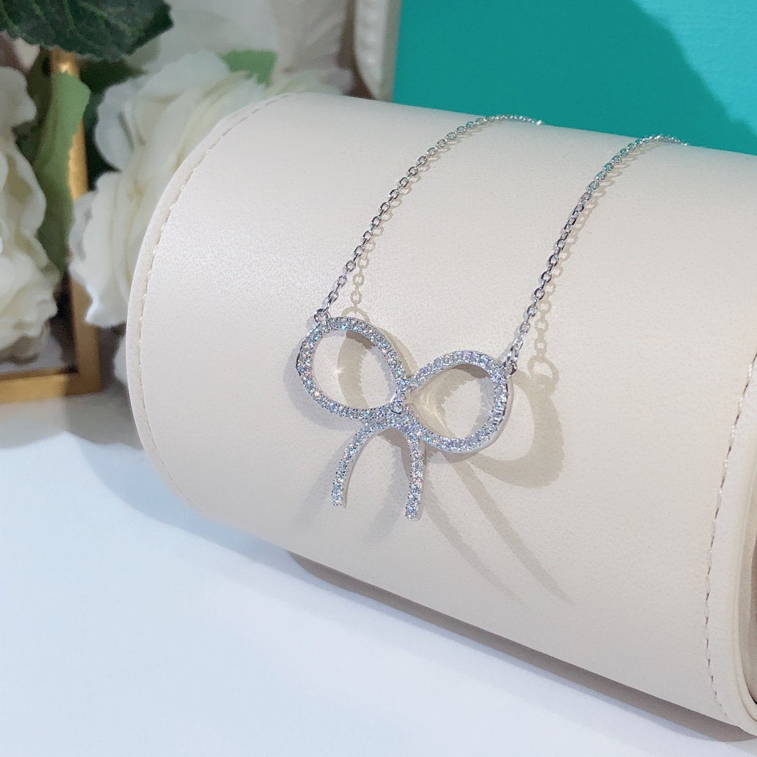 [Resenara Jewelry]CLAW SET RHODIUM PLATED BOW NECKLACE