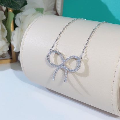 [Resenara Jewelry]CLAW SET RHODIUM PLATED BOW NECKLACE